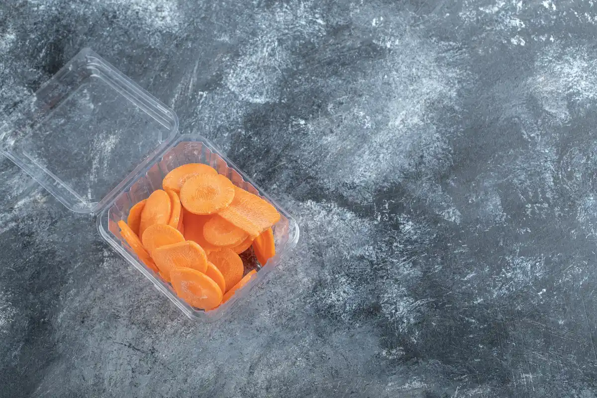 fresh carrots and lettuce in refrigerator drawer