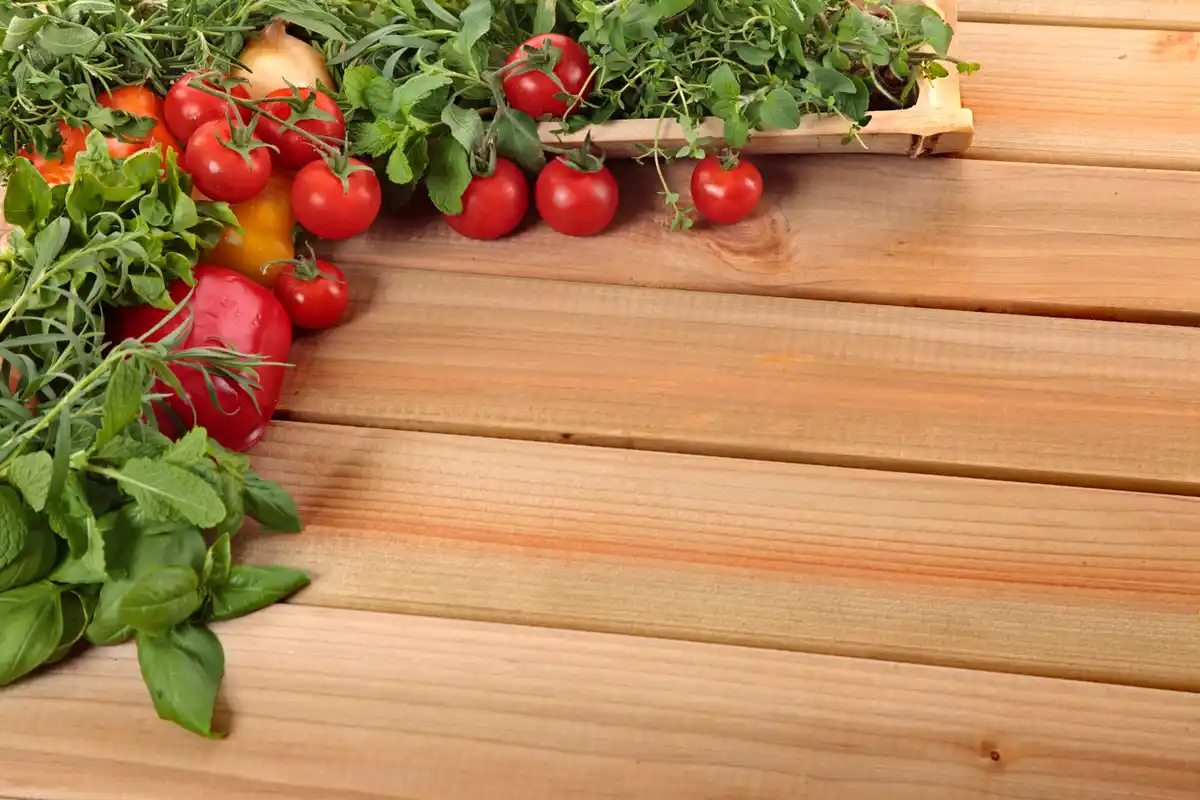 urban balcony garden with tomatoes and herbs