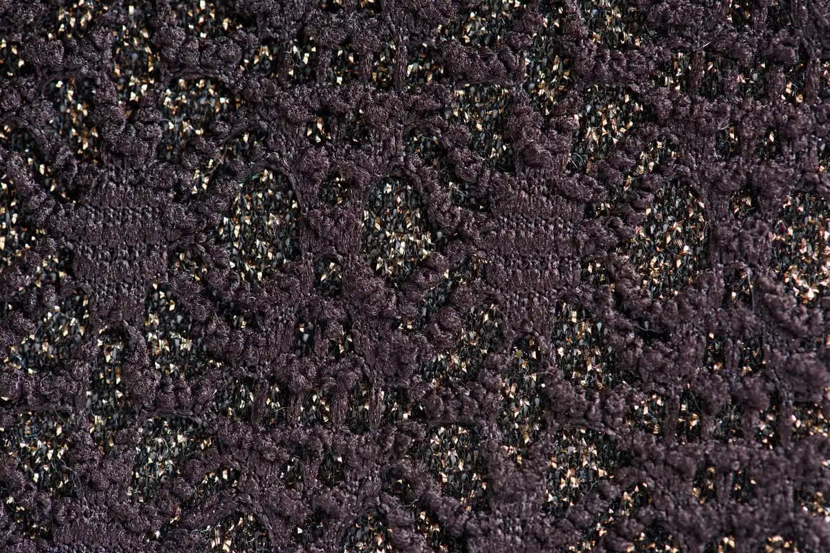 garden soil texture with carrot seedlings sprouting