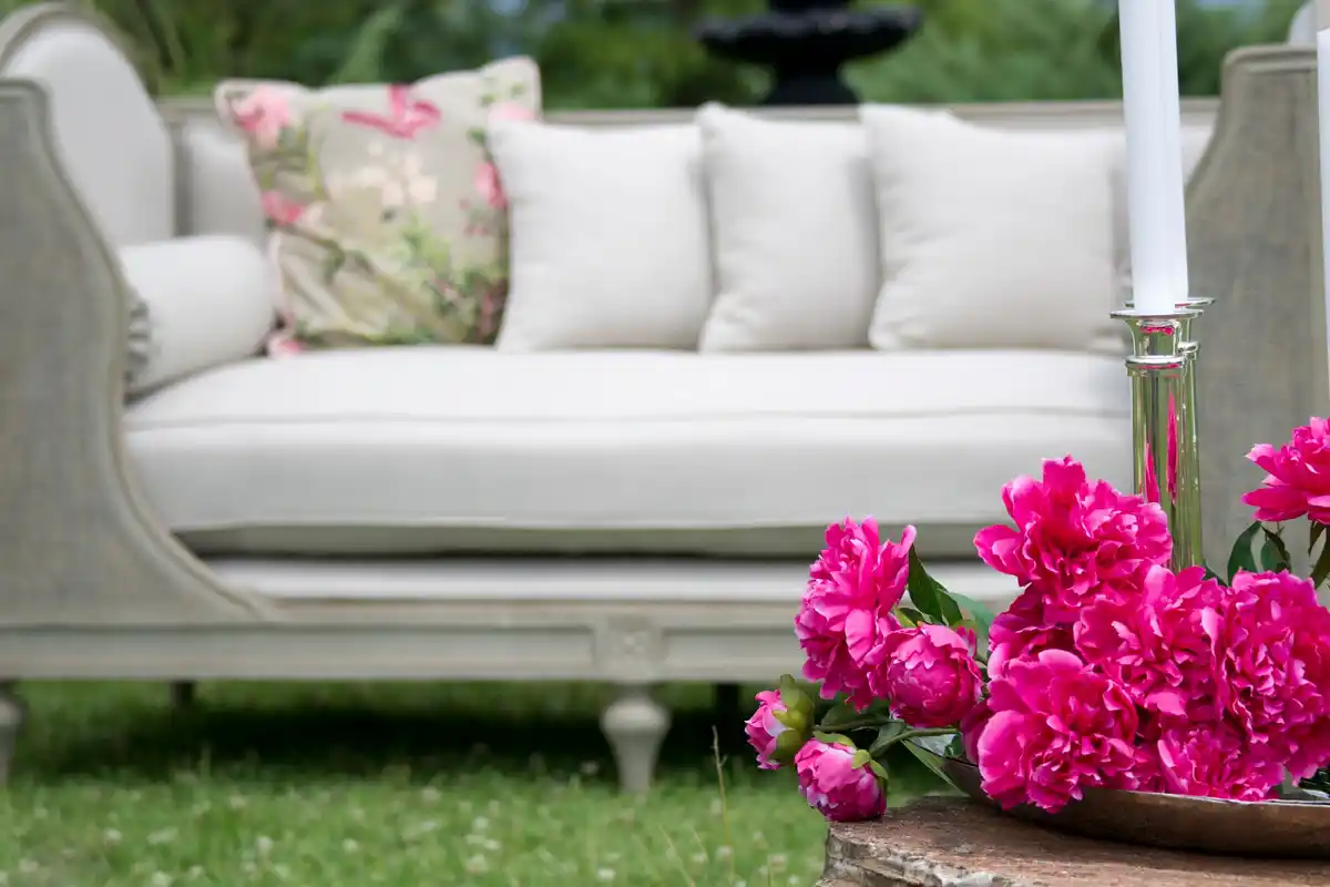 cozy garden seating area, wooden bench with colorful cushions, outdoor relaxation